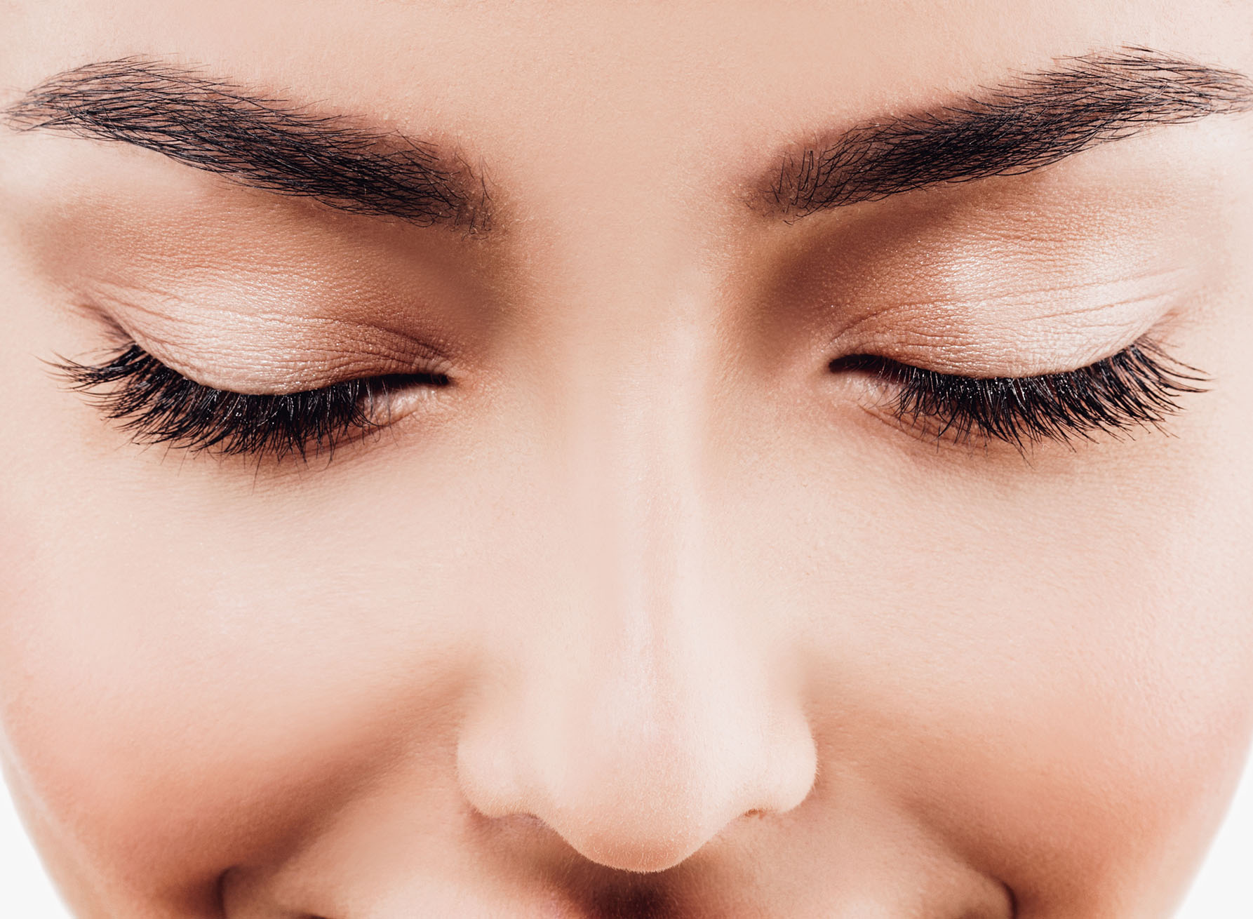 close up of womans closed eyes