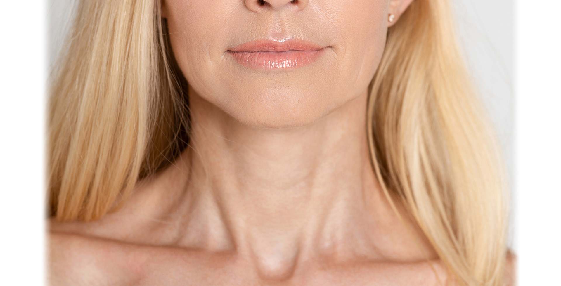 older woman touching neck