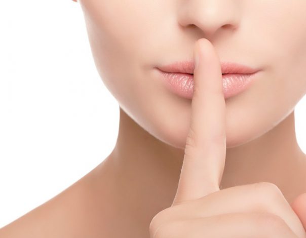woman with finger on her lips