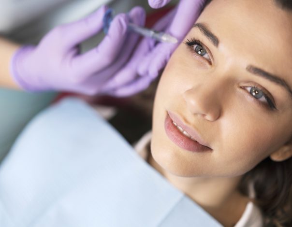 young woman receiving facial filler